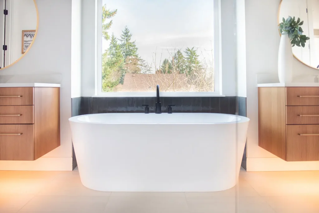 Modern bathroom renovation with dark vanity