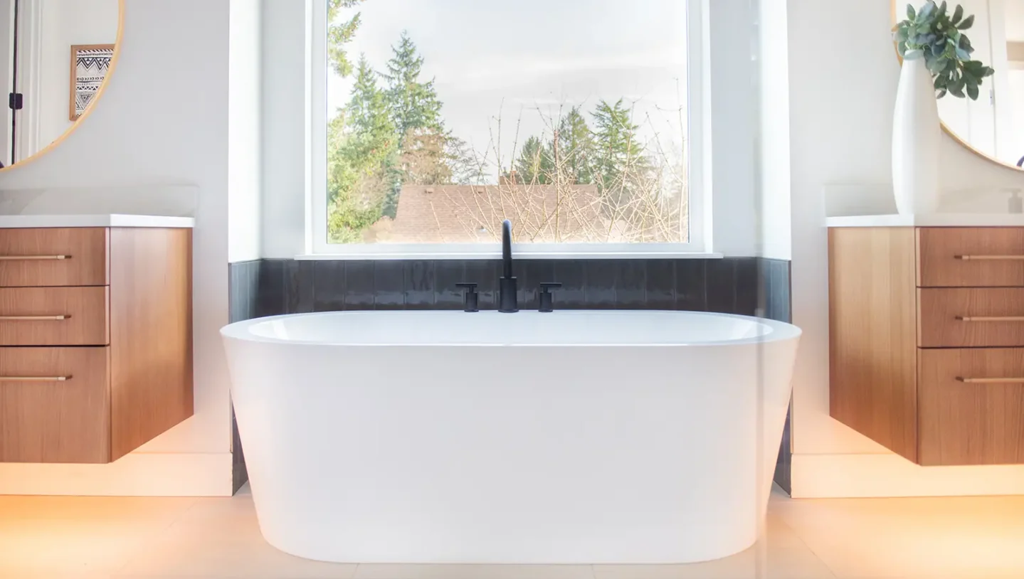 Modern bathroom renovation with dark vanity