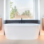 Modern bathroom renovation with dark vanity